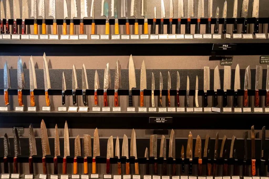 Japanese knives on display in a store.